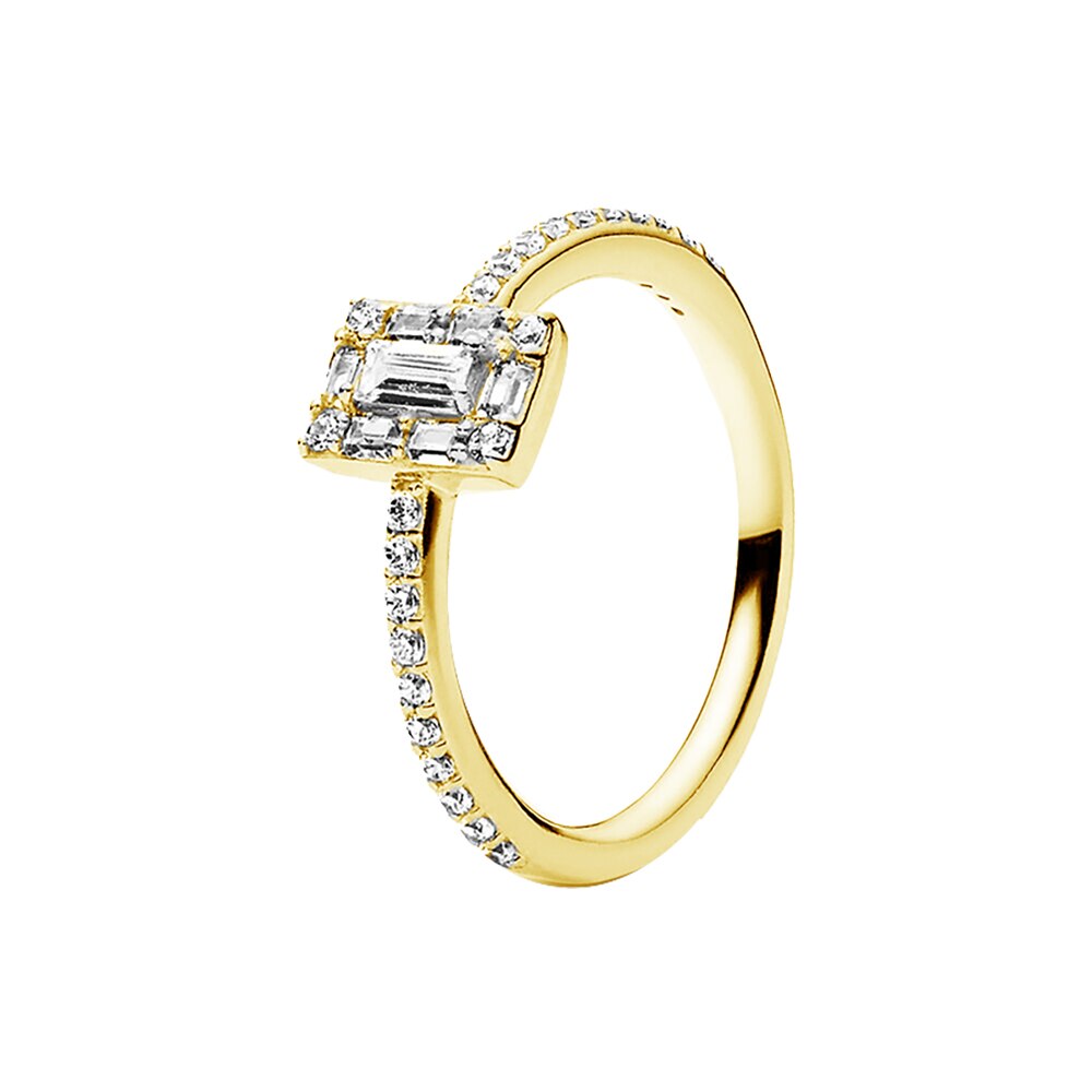 gold ring with emerald-cut diamond and smaller diamonds on a white background stone