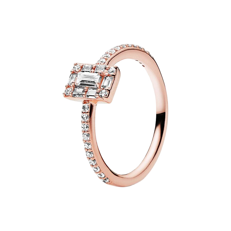 Rose gold ring with emerald-cut diamond and smaller diamonds on a white background